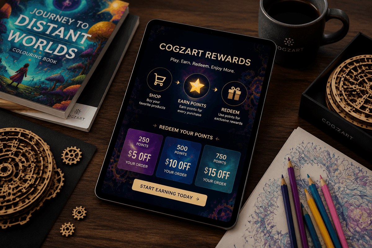 A tablet on a wooden desk displaying the CogZart Rewards app interface, surrounded by branded Cogzart items including a coloring book, wooden compass designs, a mug, and colored pencils.